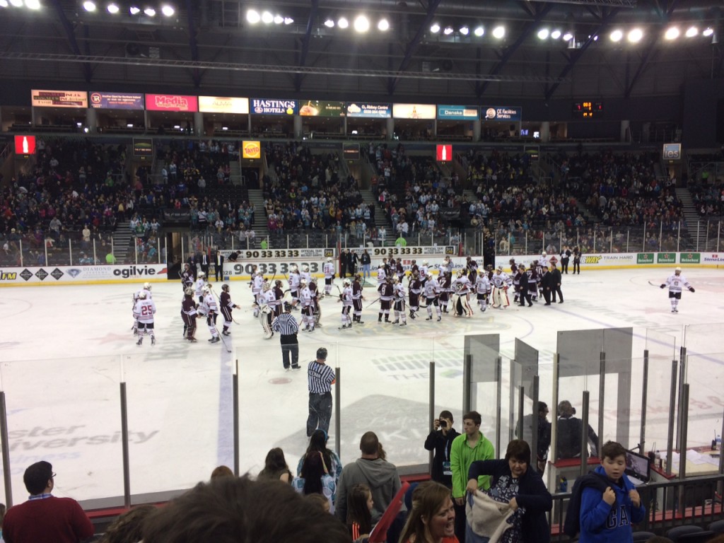 Northeastern and Colgate  after the consolation game at the Friendship Four Tournament Saturday Night in Belfast, Northern Ireland.  Photo by Jane Slaughter of Northeastern.