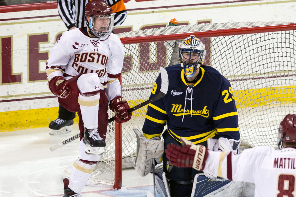 Boston College freshman forward Christopher Grando, of Islip, NY.,exults after scoring the game-winning, overtime goal against Merrimack College Saturday night, to complete their sweep of 