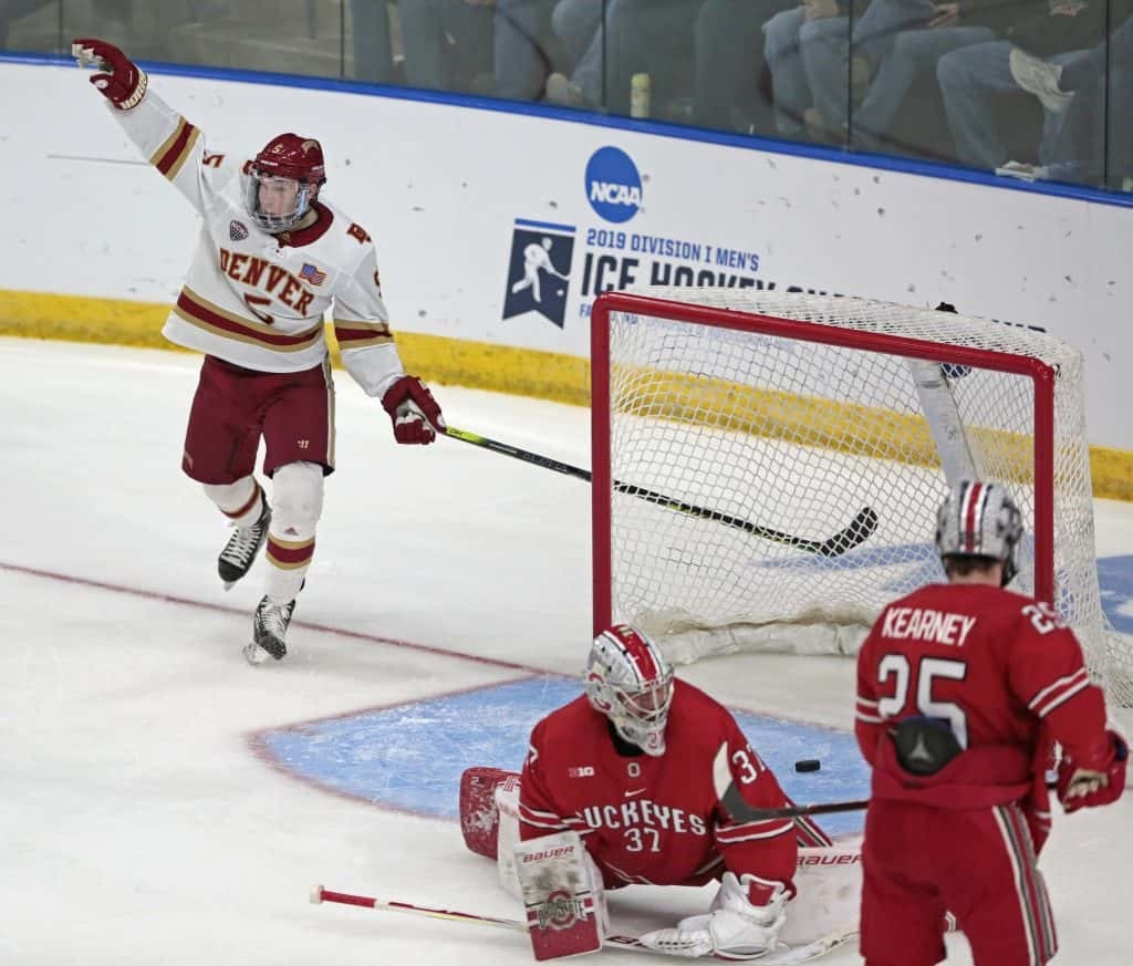 Denver senior defenseman Les Lancaster of Ypsalanti, MI., exults after scoing the game winning goal yesterday against Ohio State in the early game of the Western Regional in Fargo, N.D., as his team prevailed by a 2-0 margin.