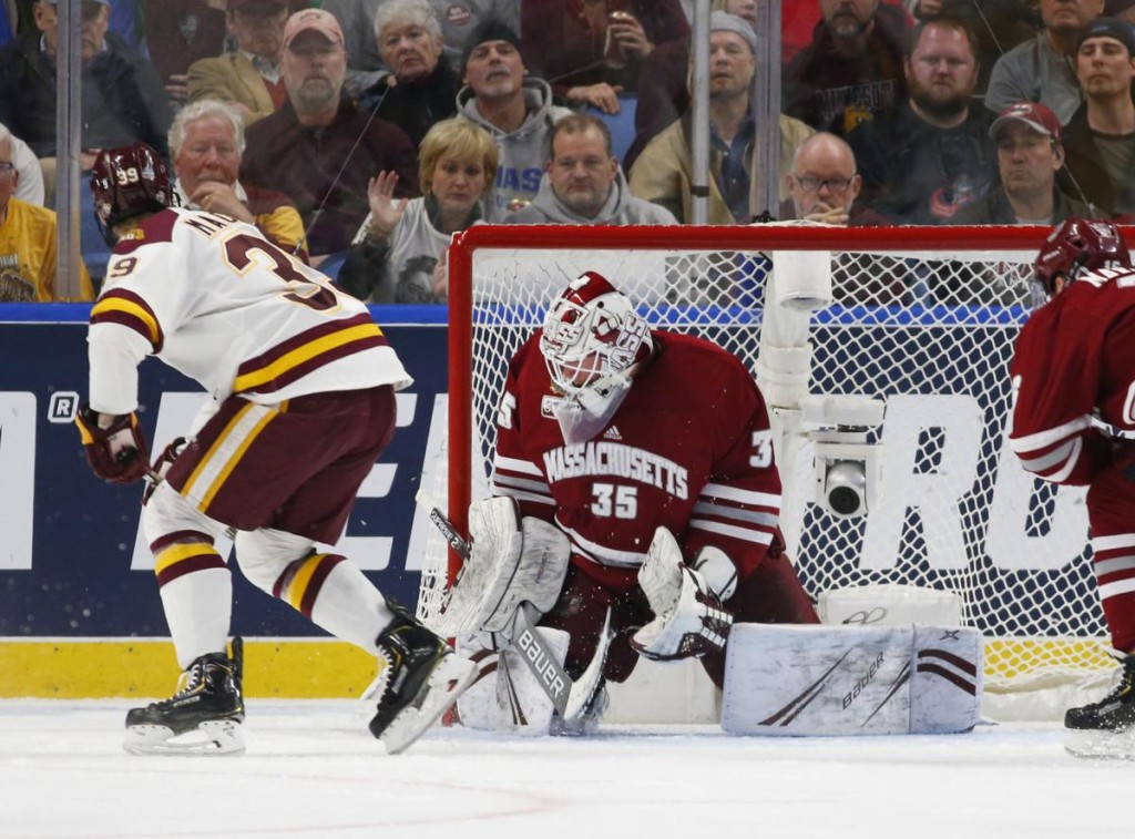 Minnesota Duluth senior forward Parker MacKay, of Irma, ALB. (left), just a second after his first-period, game-winning goal against Massachusetts in yesterday's NCAA Championship game.  MacKay was named the Most Outstanding Player of the 2019 NCAA Tournament, and he ended this season first on goals on his team, with