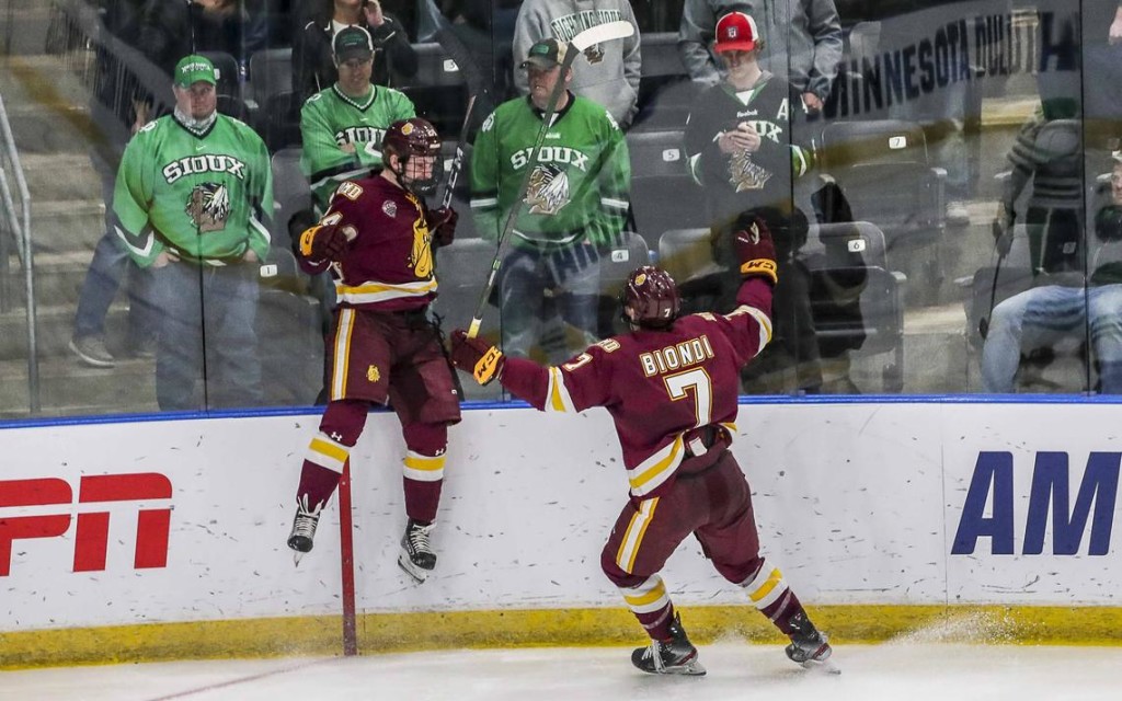 Minnesota-Duluth freshman forward Luke Mylymok, of Wilcox, SASK., goes airborne in elation after scoring the fifth-OT-period winning goal yesterday morning in his team's 3-2 win over #1 North Dakota in second round action of the NCAA Tournament in Fargo, N.D.  Minnesota-Duluth, now 15-10-2, and ranked #9, will face #6 Massachusetts in the Frozen Four This is the fourth consecutive Frozen Four appearance for Minnesota-Duluth, the two-time NCAA defending champion.