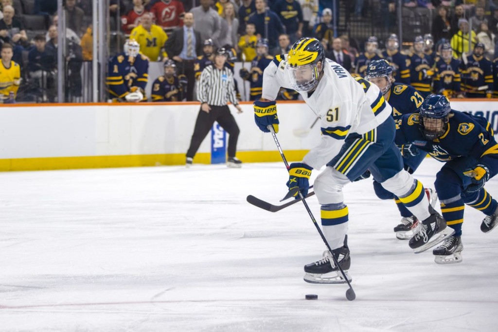 Michigan senior forward Garrett Van Wyhe, of Seattle, WA., scored a goal in his team's 7-4 win over Quinnipiac in the Midwestern Region Final game in Allentown, PA., on Sunday, March 27th.  Van Wyhe is tied for eleventh on his team in goals scored, with six, and is tied for eighteenth on the team in assists, with five.  Michigan advanced to play Denver in a Frozen Four semifinal game in Boston on Thursday (tomorrow), April 7th, at 2:00PM Pacific Time on ESPN2.